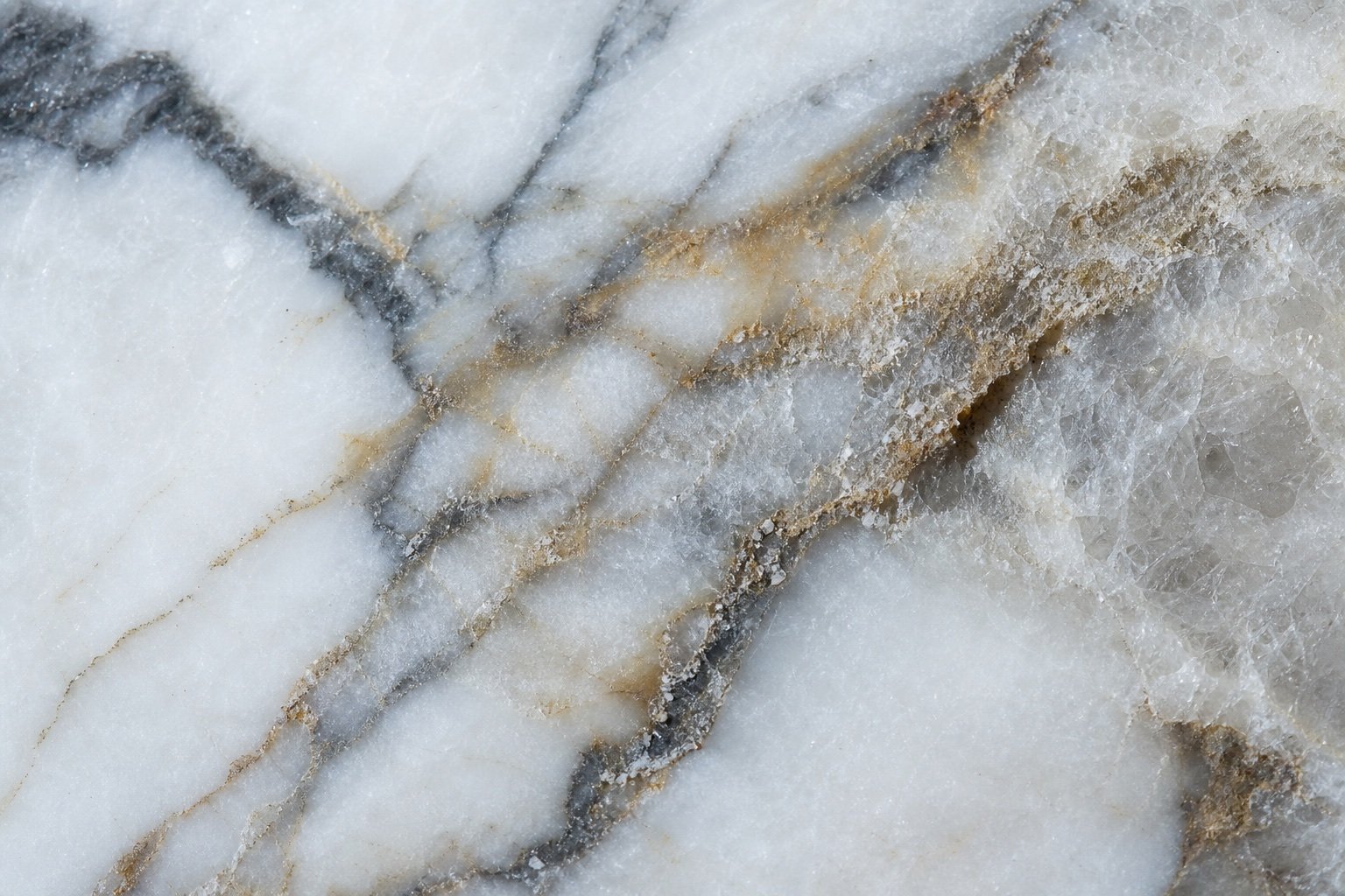 Macro view of crystalline structure and veining in white marble
