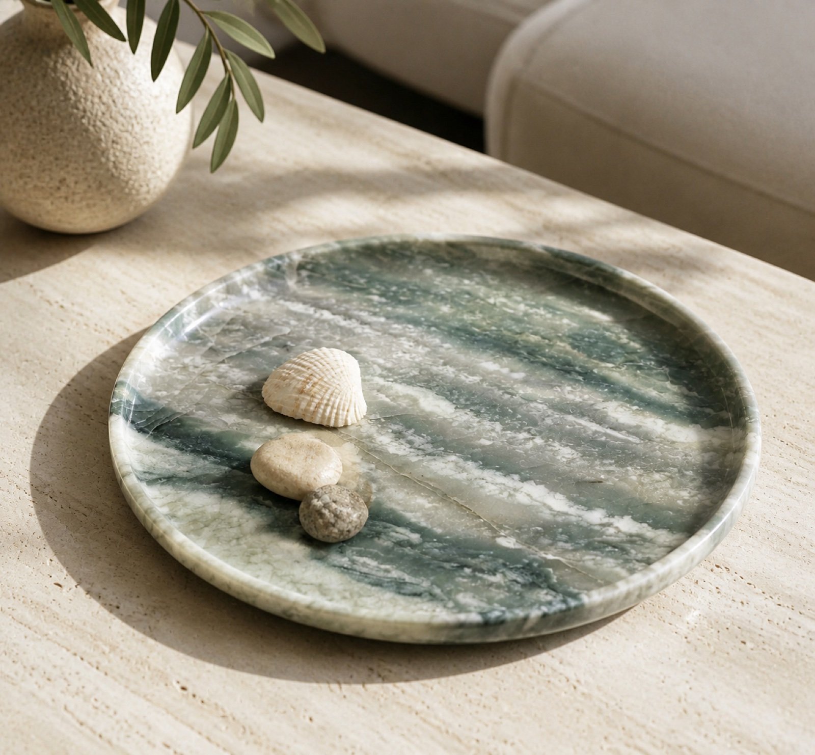Green Round Stone Display Platter in a styled natural stone interior