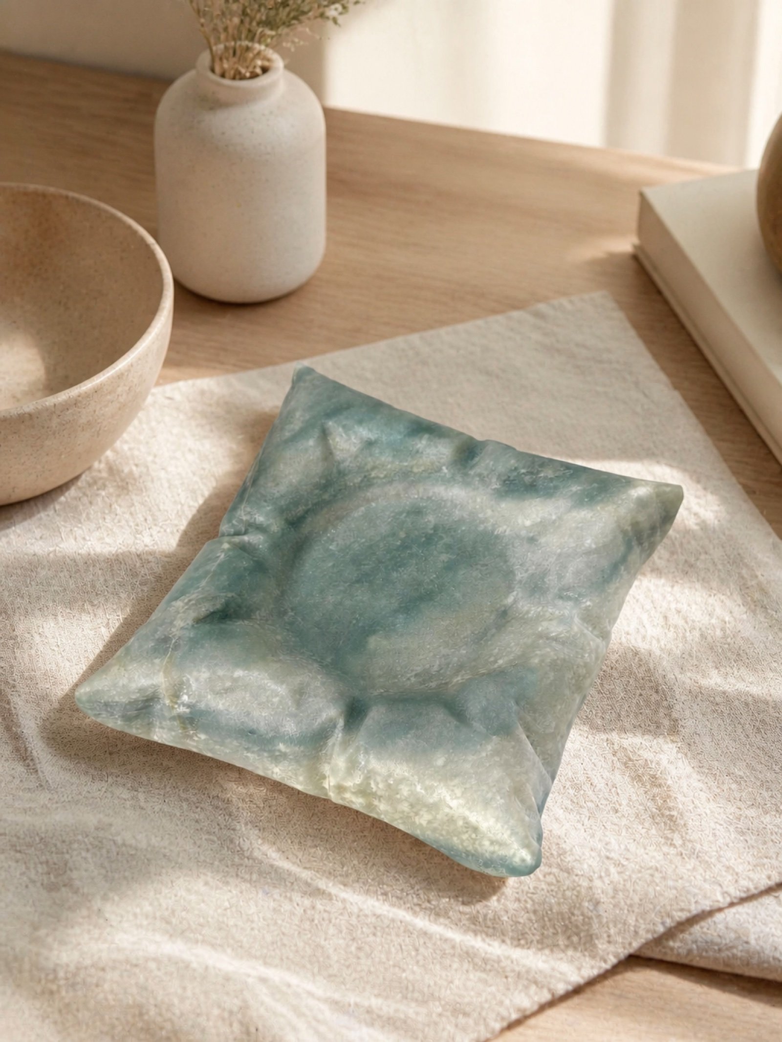 Green Pillow Object in a styled natural stone interior