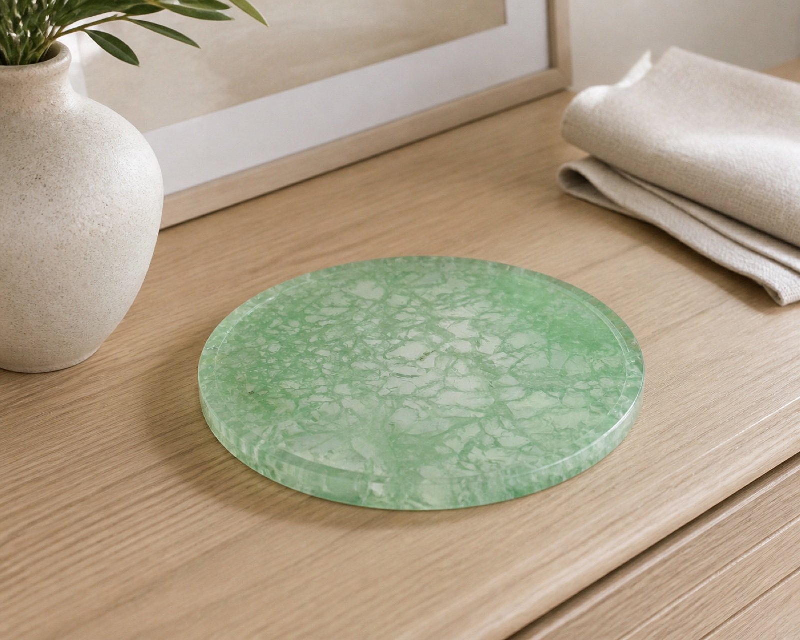 Green Round Plaque in a styled natural stone interior