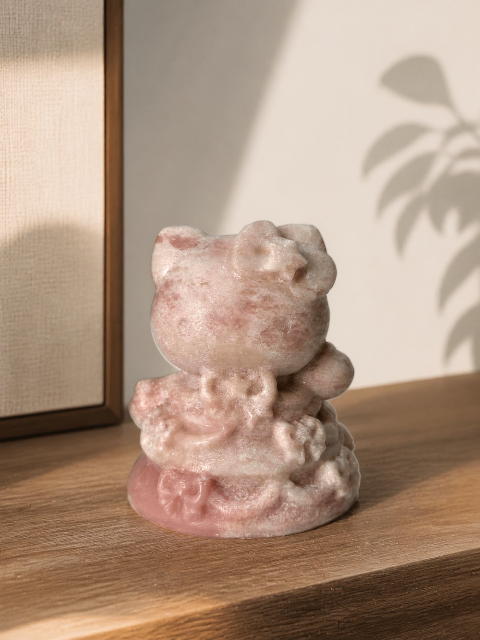 Pink Cat Statue in a styled natural stone interior