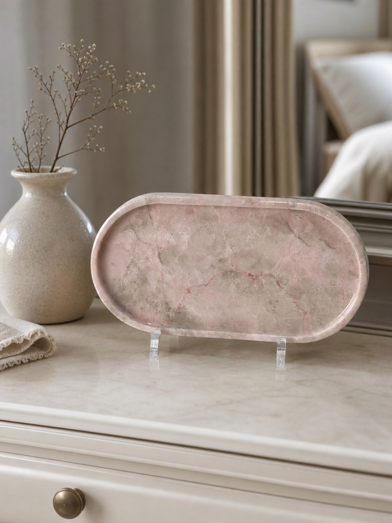 Pink Oval Stand Plaque in a styled natural stone interior