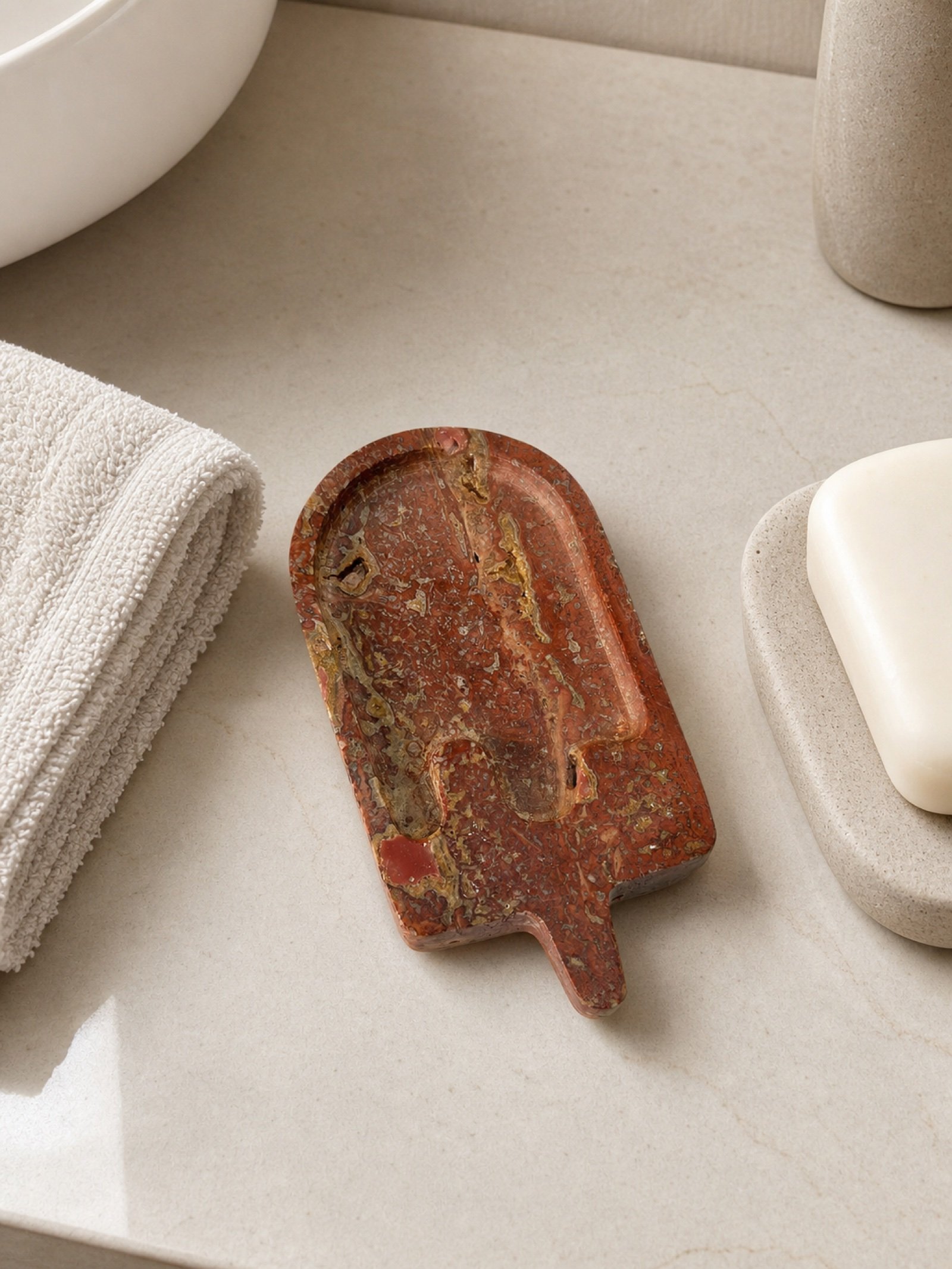 Red Paddle Tray in a styled natural stone interior